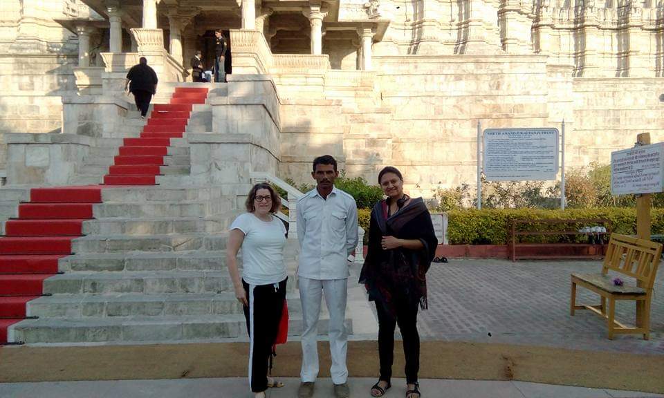 our happy customers for jodhpur full day tour bacground is jaswant thada the pace where king's grave were kept.